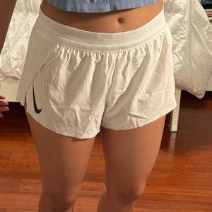 Nike Women's White Athletic Shorts with Black Swoosh